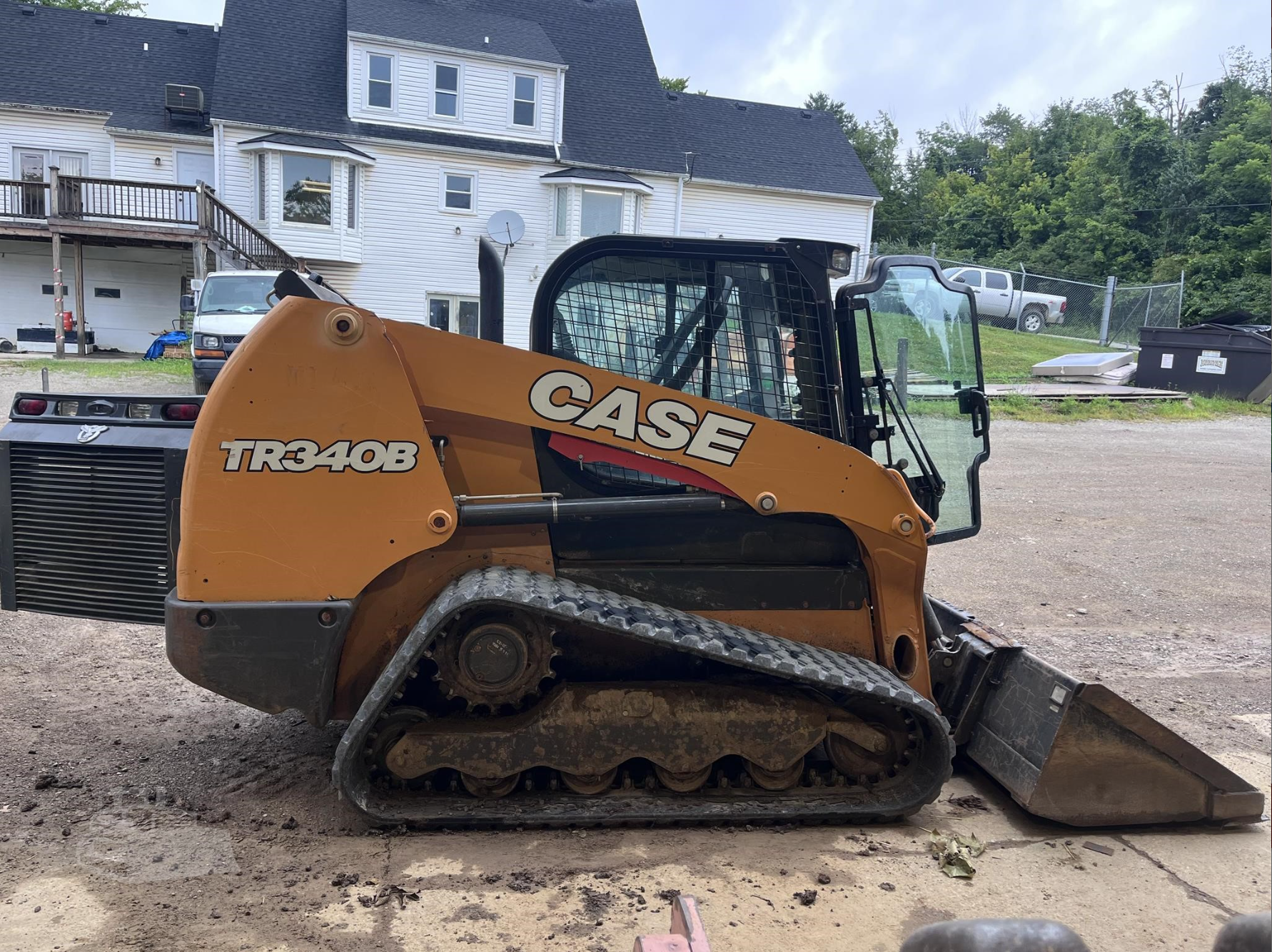 Orange Case tracked loader side view