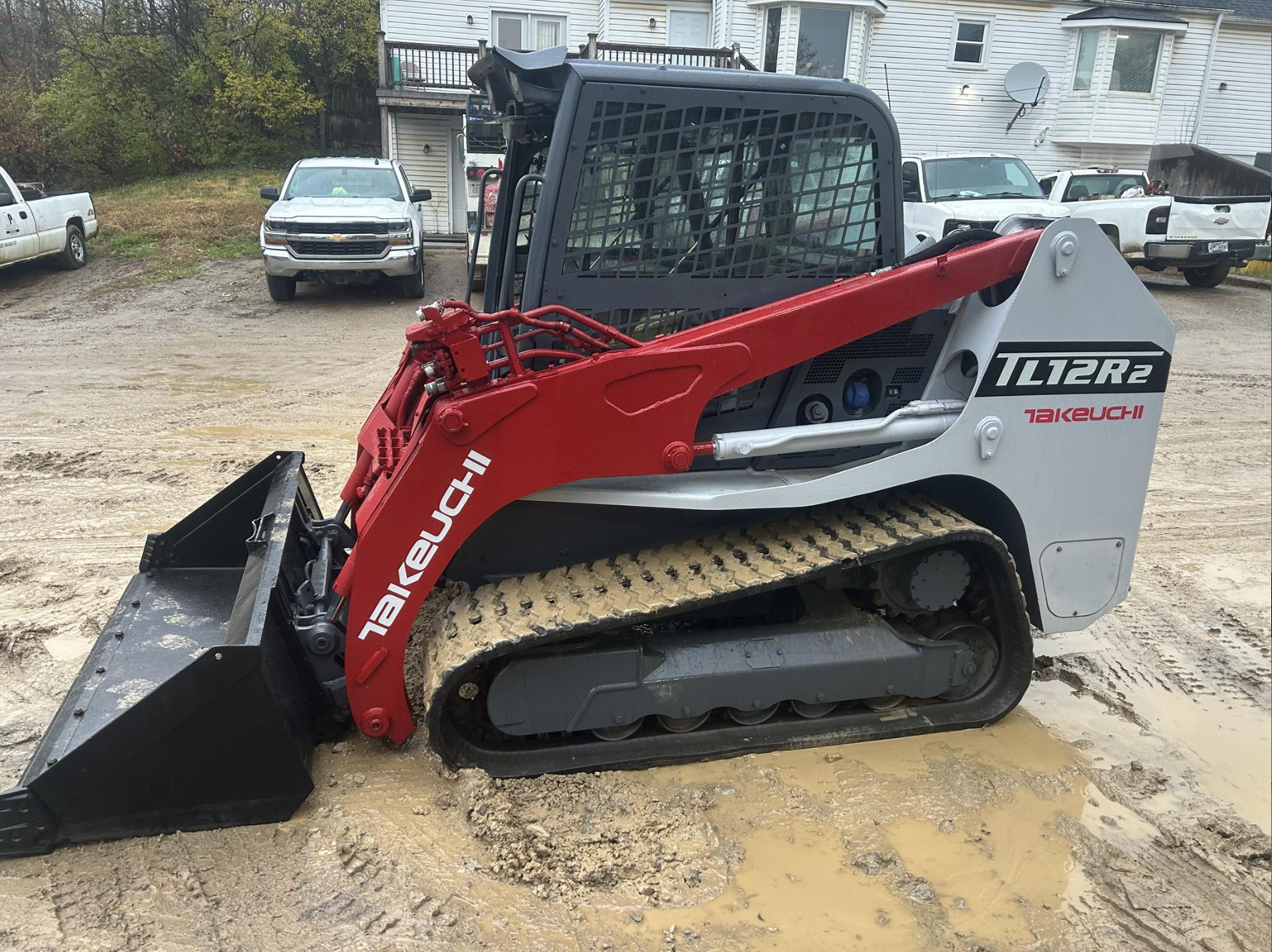 Red compact tracked loader
