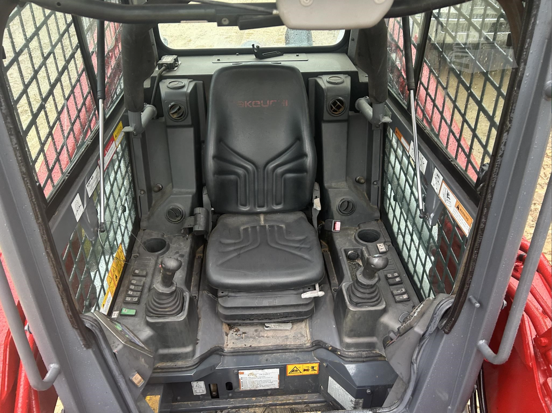 Interior seat of compact tracked loader